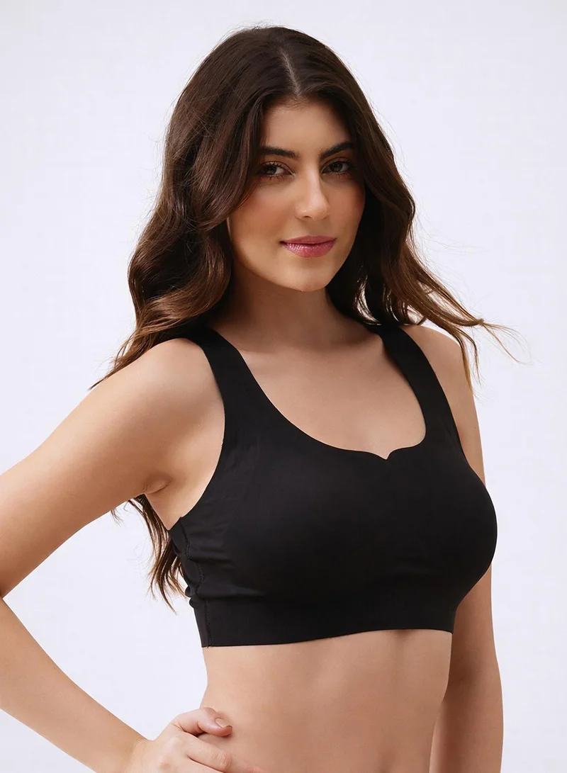 Clovia Black Padded Non-Wired Full Coverage Seamless Bonded Slip-on Bra in Black for Women | Best Price UAE